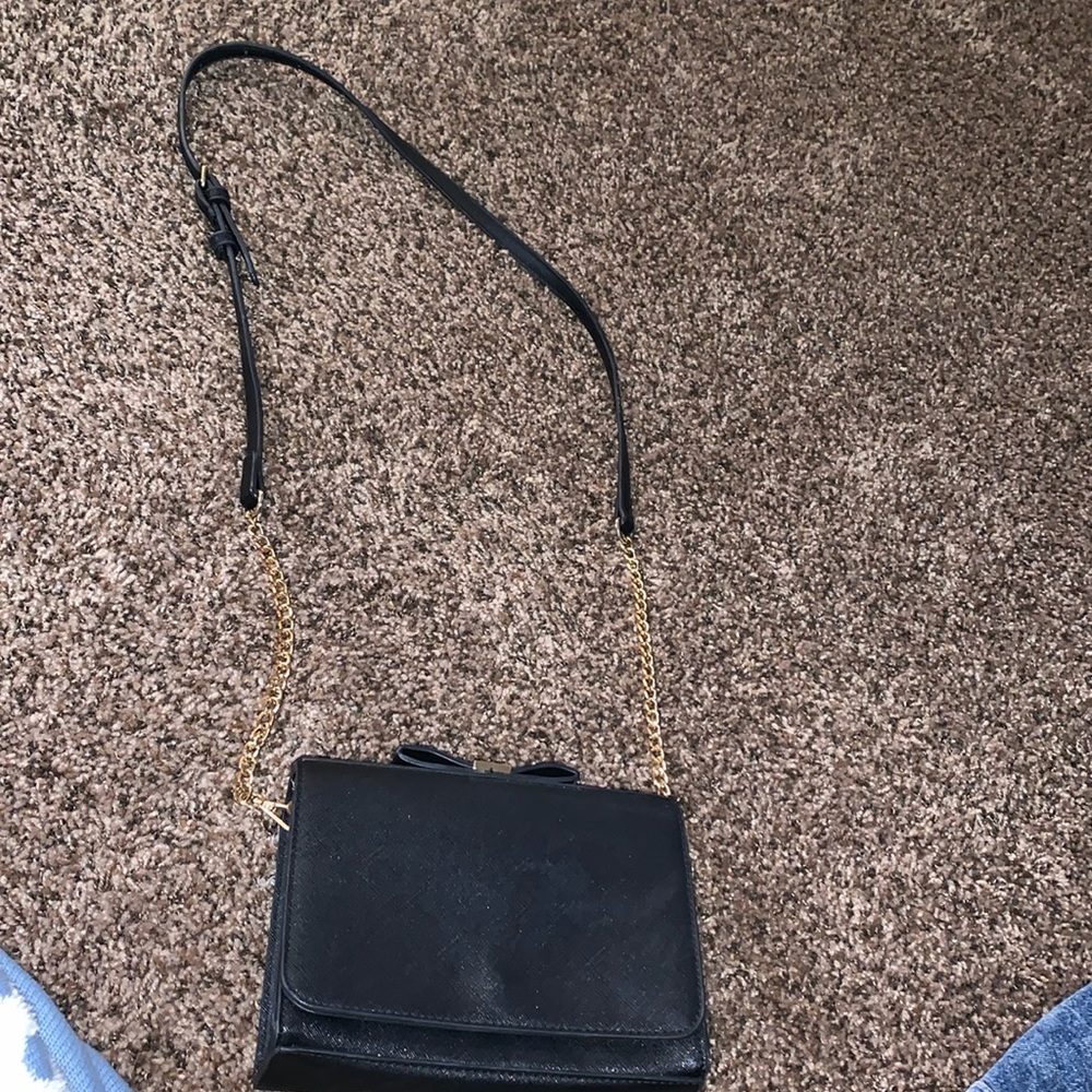 Black cross body purse lightly used missing one zipper still works